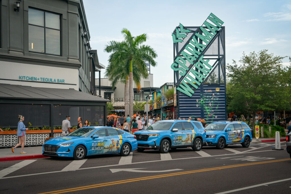 Carvertise’s Visit Tampa Bay Branded Chauffeur vehicles line up to pick up passengers
